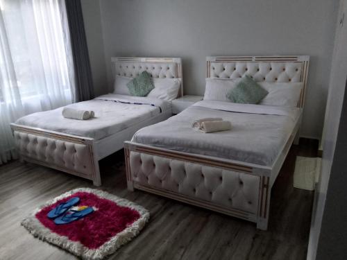 Ένα ή περισσότερα κρεβάτια σε δωμάτιο στο HK Villas