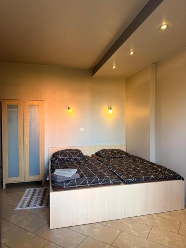 Postel nebo postele na pokoji v ubytování Apartamenty Gliwicka 12