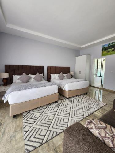 En eller flere senge i et værelse på Olivoak