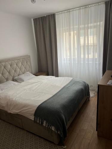 Postel nebo postele na pokoji v ubytování Apartament centru