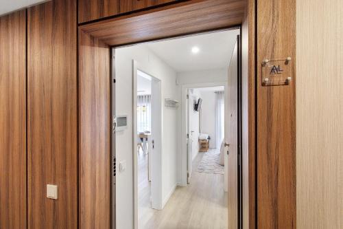 a hallway with a door leading into a room at Coral Beach Oasis in Figueira da Foz