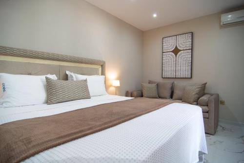 a bedroom with a large bed and a window at Tango Sunset Villa in Paleokastritsa