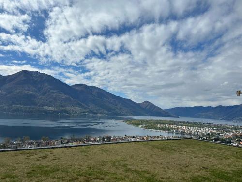 a view of a large body of water with mountains at Minusio - Locarno Casa del Nibbio in Minusio