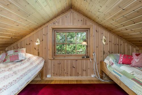 Ένα ή περισσότερα κρεβάτια σε δωμάτιο στο Fjellkos, mountain cabin in Gol