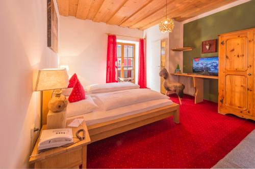 Postel nebo postele na pokoji v ubytování Hotel Gamshof