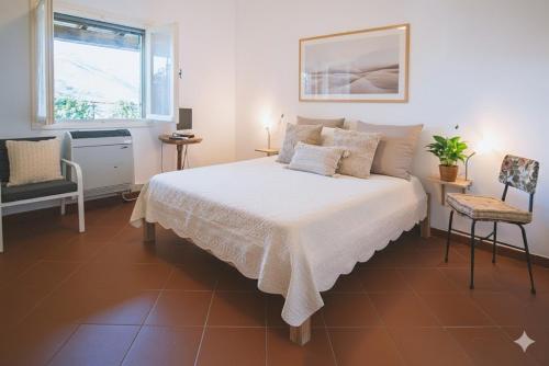 Ένα ή περισσότερα κρεβάτια σε δωμάτιο στο Villa Ponzio