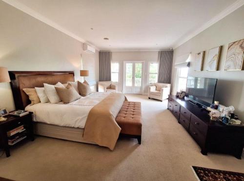 Postel nebo postele na pokoji v ubytování Peaches Property