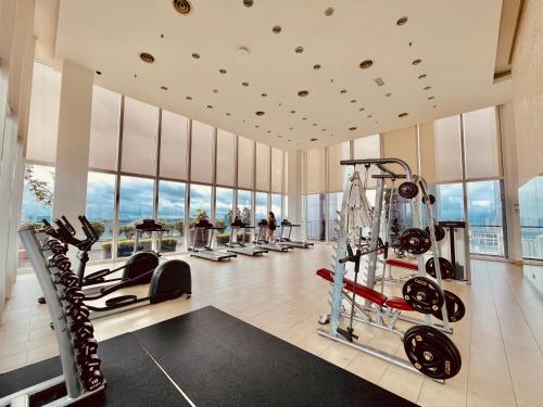 a gym with treadmills and cardio equipment in a building at Platinum Grand Stay Kuala Lumpur in Kuala Lumpur