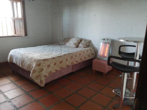 Ένα ή περισσότερα κρεβάτια σε δωμάτιο στο Eco Hostal Arroyave