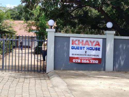 a sign on a fence in front of a house at Khaya guesthouse in Rustenburg