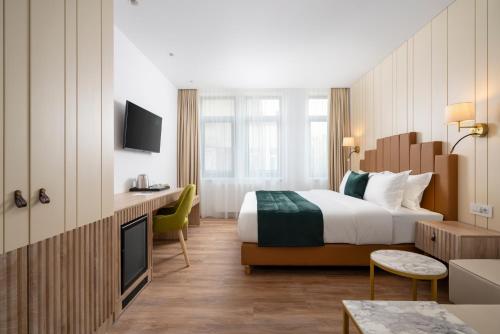 Ένα ή περισσότερα κρεβάτια σε δωμάτιο στο Hotel Epica