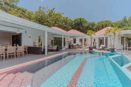 Panoramic Pool Deck And Garden Oasis