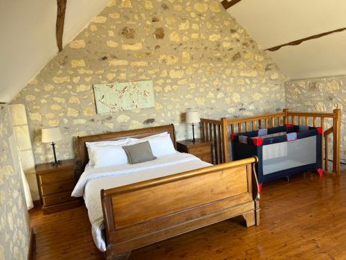 Postel nebo postele na pokoji v ubytování Gites de La Richardiere