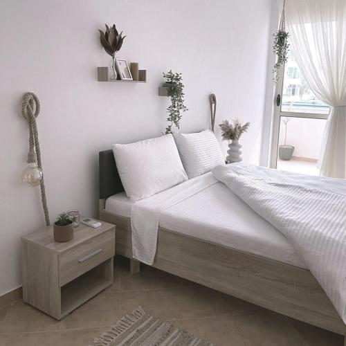 Postel nebo postele na pokoji v ubytování Valona boho apartment