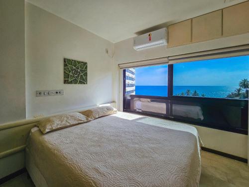 Ένα ή περισσότερα κρεβάτια σε δωμάτιο στο Ondina Vista Mar 733