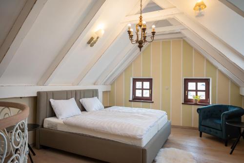 a bedroom with a bed in a attic at Apartmaji Hiša kranjske čebele in Višnja Gora