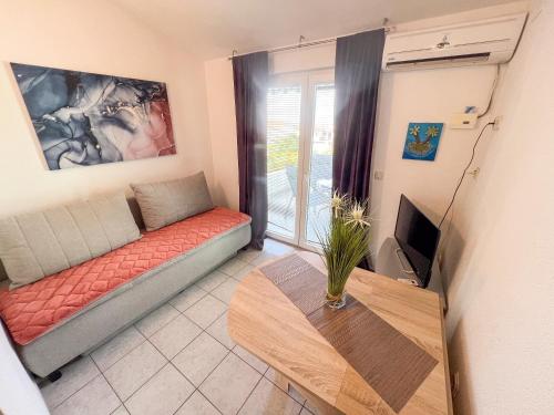 Postel nebo postele na pokoji v ubytování Apartments Natalika