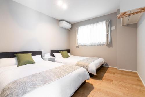 Postel nebo postele na pokoji v ubytování Grandioso Okinawa Villa Kin 2 - Vacation STAY 08755v