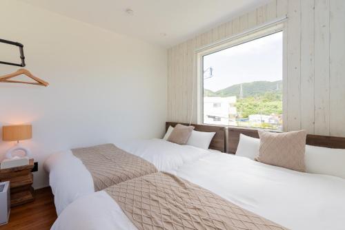 Postel nebo postele na pokoji v ubytování Grandioso Okinawa Villa Kin 2 - Vacation STAY 37331v