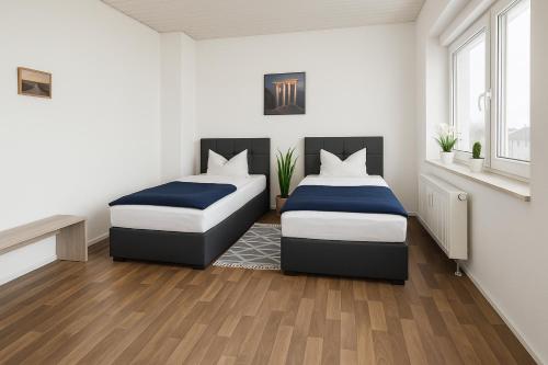 Ένα ή περισσότερα κρεβάτια σε δωμάτιο στο SUNNYHOME Monteurwohnungen und Apartments in Weiden