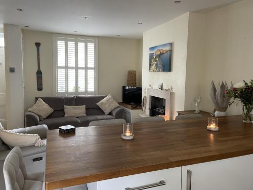 a living room with a couch and a table at Conwy Castle cottage in Conwy