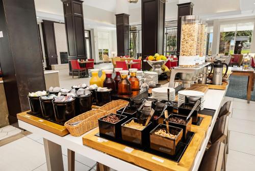 a buffet of food on a table in a restaurant at Hilton Garden Inn New Braunfels in New Braunfels