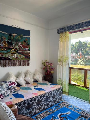 Postel nebo postele na pokoji v ubytování Wang Homestay