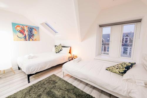 Ένα ή περισσότερα κρεβάτια σε δωμάτιο στο Modern Cosy Studio Getaway - Fast WiFi