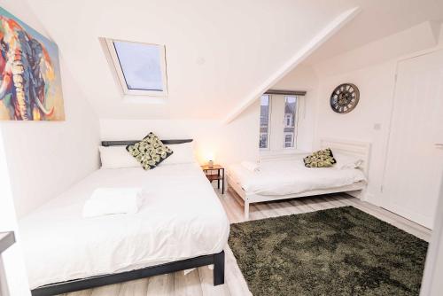 Ένα ή περισσότερα κρεβάτια σε δωμάτιο στο Modern Cosy Studio Getaway - Fast WiFi