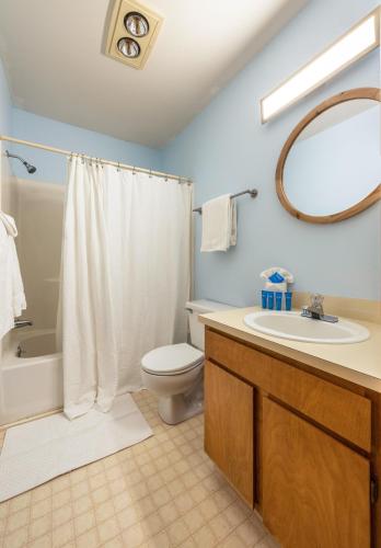 a bathroom with a toilet and a sink and a shower at 04 Lodge in Hood River