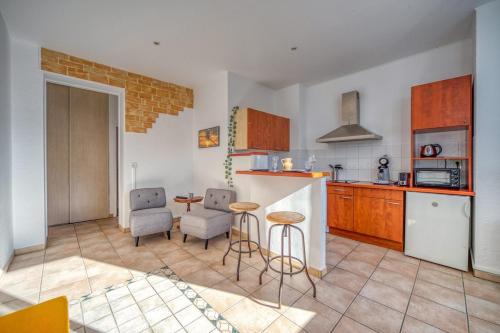 Kuchyň nebo kuchyňský kout v ubytování Le petit Grésivaudan