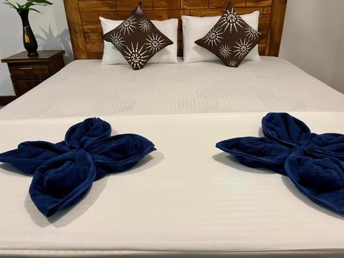 Postel nebo postele na pokoji v ubytování Jungle Nook Hiriketiya