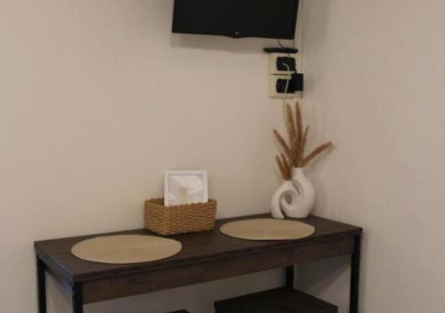 a table with two mats on top of it at La Piazzetta Apartment in Pietralunga