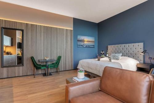 Ένα ή περισσότερα κρεβάτια σε δωμάτιο στο Hotel Muli