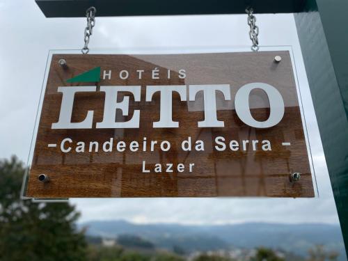 a sign for a hotel la centoriacanocano sign at Letto Hotel Candeeiro da Serra in Salvador do Sul