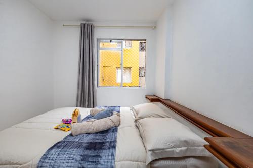 En eller flere senge i et værelse på Apartamento inteiro de 1 quarto no Edifício Royal Light