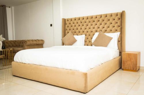 Ένα ή περισσότερα κρεβάτια σε δωμάτιο στο Libi Apartment-BlueWaters Property Mgt LTD