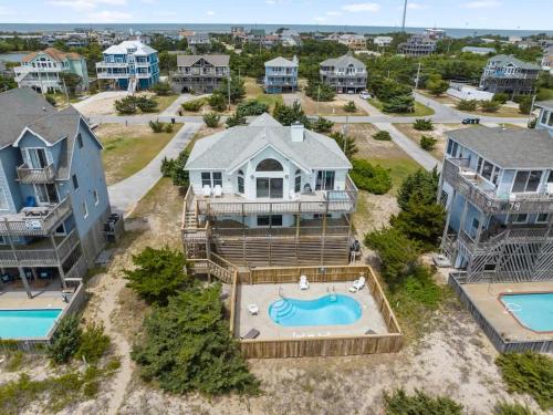 an aerial view of a house with a swimming pool at Elegant Updated Oceanfront Home with Pool & Hot Tub in Waves