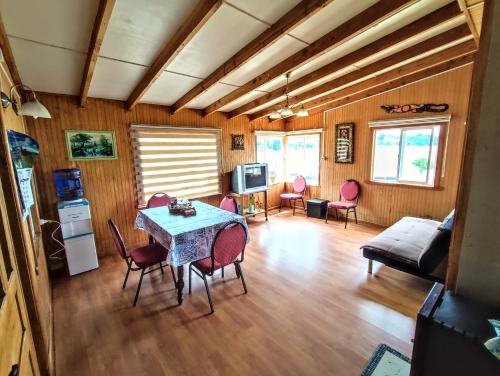 a living room with a table and chairs at Casadelaisla-Rilan in Rilán