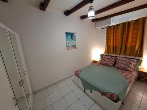 Postel nebo postele na pokoji v ubytování Jardin creole