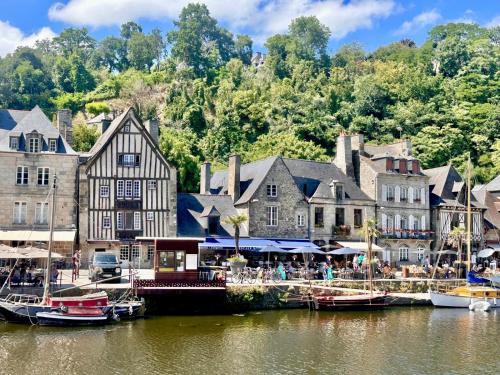 a group of boats docked at a marina on the water at Appartement au port de Dinan Belle île in Dinan