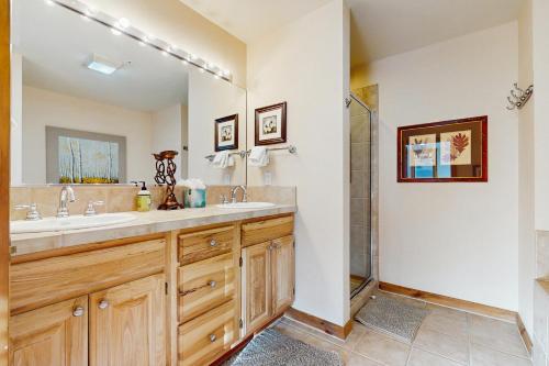 a bathroom with two sinks and a shower at Main Street Station #2302 in Breckenridge