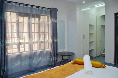 Voodi või voodid majutusasutuse Tausi mweupe toas