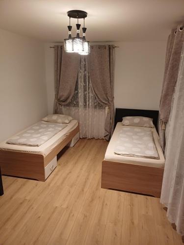 Ένα ή περισσότερα κρεβάτια σε δωμάτιο στο Maxhaus 3