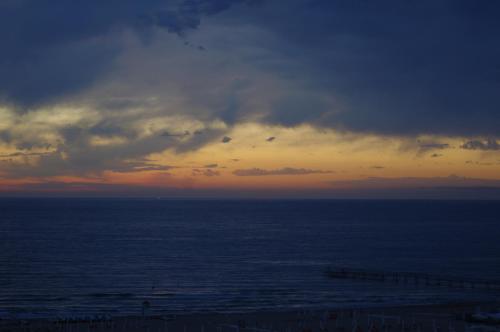a cloudy sky over the ocean at sunset at Hotel Grifone in Rimini