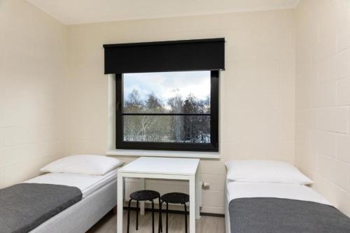 Postel nebo postele na pokoji v ubytování Reti tee 11 külaliskorterid