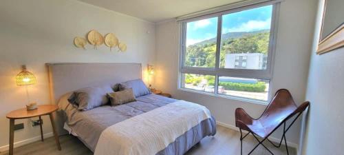 En eller flere senge i et værelse på Rbk° Depto nuevo en condominio en Papudo