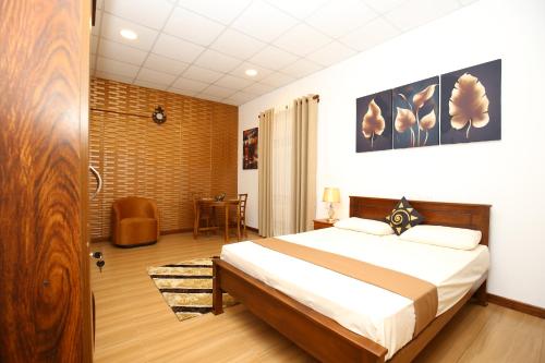 a bedroom with a large bed in a room at Ideal Residence in Matara