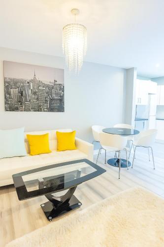 a living room with a couch and a table at 2 Bedroom Apartment Limerick City Centre in Limerick
