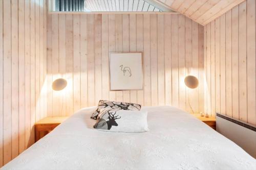 a bedroom with a bed with a pillow on it at 30193-Odder-Thorasvej-79 in Odder